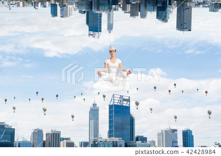 Young woman keeping mind conscious. 42428984