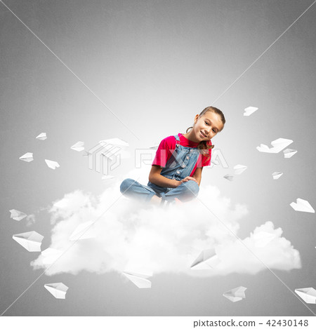 Concept of careless happy childhood with girl dreaming about something Concept of careless happy childhood with girl dreaming about something 42430148