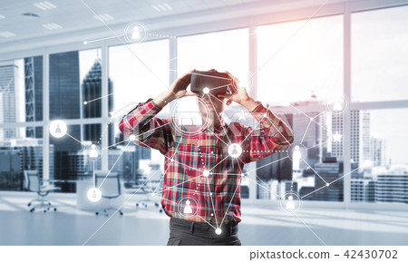 Guy wearing checked shirt and virtual mask demonstrating some emotions 42430702