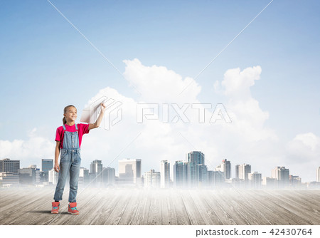 Concept of careless happy childhood with girl dreaming about future Concept of careless happy childhood with girl dreaming about future 42430764
