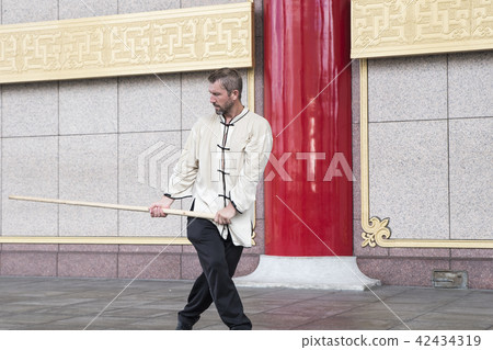 Westerners dancing Taiji sticks Westerners dancing Taiji sticks 42434319