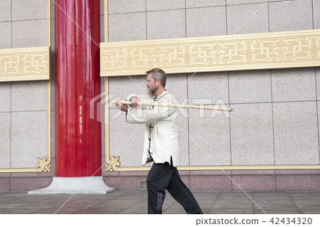 Westerners dancing Taiji sticks Westerners dancing Taiji sticks 42434320