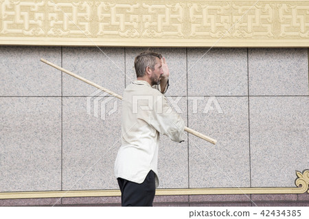 Westerners dancing Taiji sticks 42434385