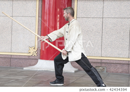 Westerners dancing Taiji sticks Westerners dancing Taiji sticks 42434394