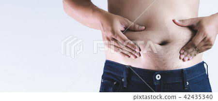Man touching his fat belly chubby 42435340