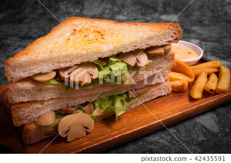 Tasty Sandwich with mushrooms with French fries Tasty Sandwich with mushrooms with French fries 42435591