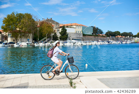 riding a bike on the sidewalk