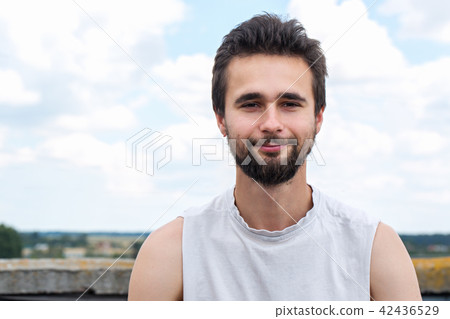 Portrait of a young man with a beard close-up Portrait of a young man with a beard close-up 42436529