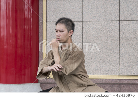 Martial artist practicing Tai Chi 42436970