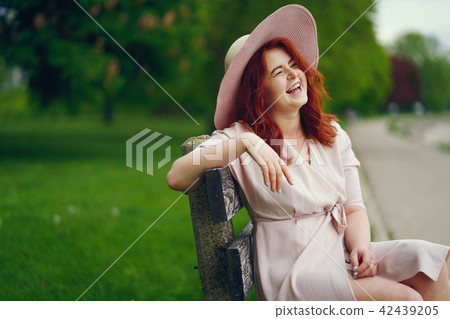 pretty girl in a park pretty girl in a park 42439205
