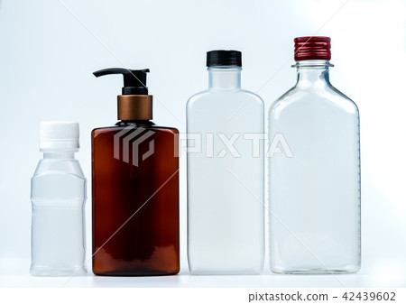 Empty plastic and glass bottle with cap and pump  Empty plastic and glass bottle with cap and pump  42439602