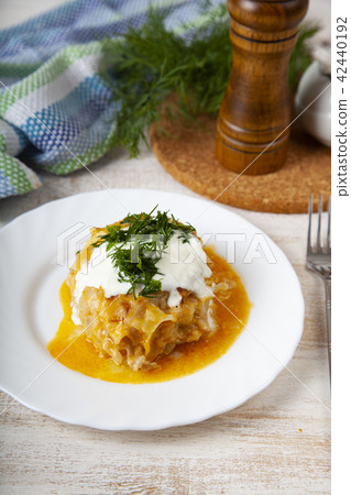 Lazy cabbage rolls on a wooden table. Lazy cabbage rolls on a wooden table. 42440192