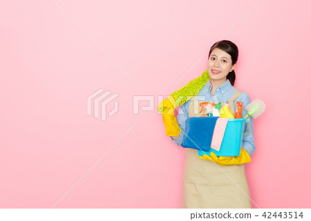confident woman holding a yellow feather stick 42443514