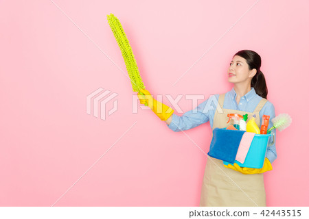 confident woman swaying a yellow feather stick 42443515