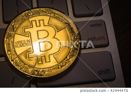 Cryptocurrency gold Bitcoin on keyboard. 42444478