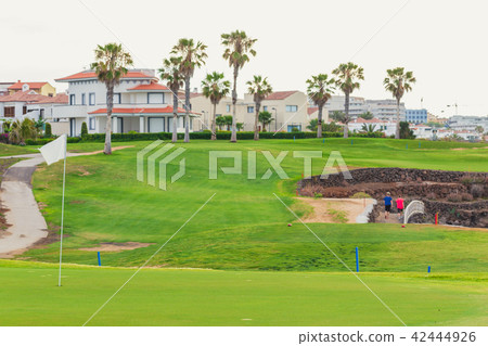 Golf course along rocky coastline. Golf course along rocky coastline. 42444926