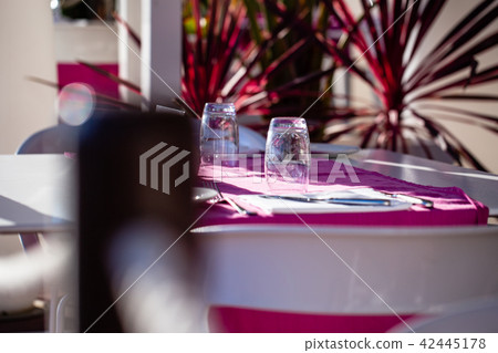 Tablecloth and inverted empty glasses Tablecloth and inverted empty glasses 42445178