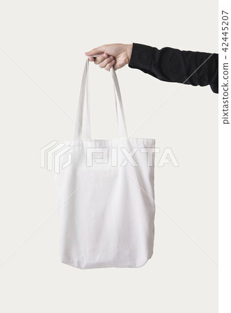 Hand holding bag canvas fabric for mockup template Hand holding bag canvas fabric for mockup template 42445207