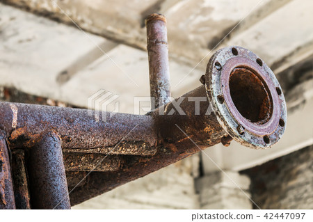old rusty pipes in the destroyed boiler room  42447097