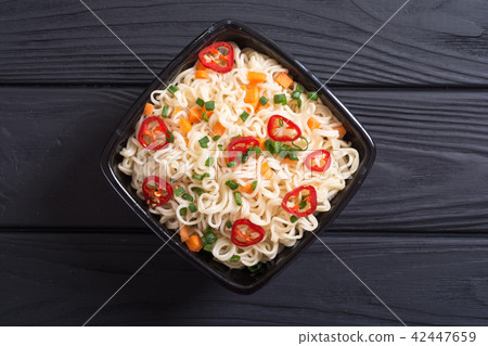 Instant noodles in bowl 42447659