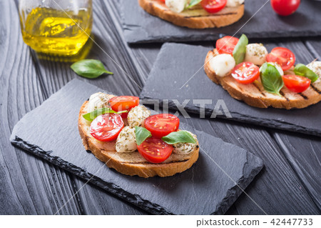 sandwich with mozzarella and cherry tomatoes 42447733