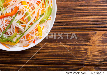 Salad from rice noodles with vegetables Salad from rice noodles with vegetables 42448234