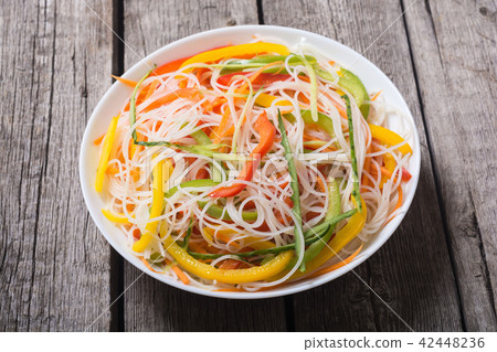 Salad from rice noodles with vegetables Salad from rice noodles with vegetables 42448236