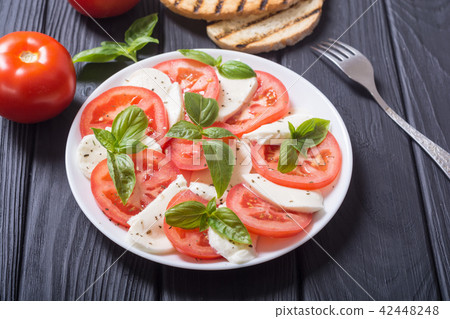 Caprese salad with mozzarella Caprese salad with mozzarella 42448248