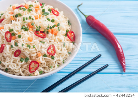 Instant noodles in bowl 42448254