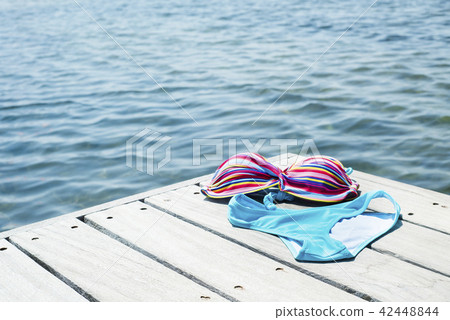 bikini drying on a wooden pier 42448844