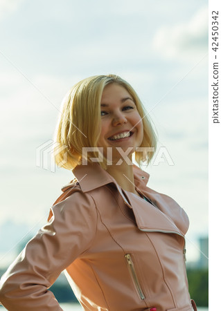 Portrait of woman in park 42450342