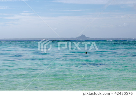 A picture of a beautiful sea and an island A picture of a beautiful sea and an island 42450576