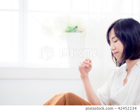 Tormented young gril in her bedroom Tormented young gril in her bedroom 42452134