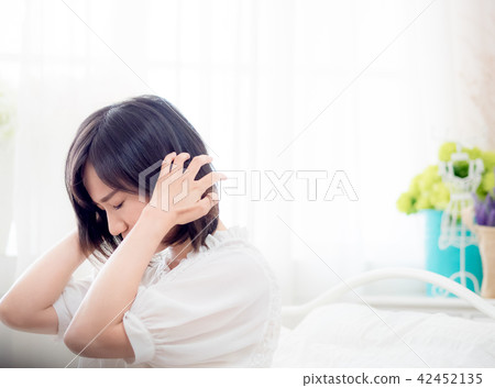 Tormented young gril in her bedroom Tormented young gril in her bedroom 42452135