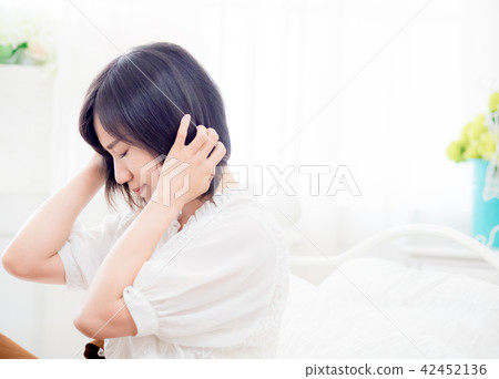 Tormented young gril in her bedroom 42452136