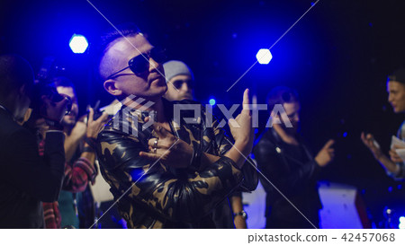 Rock musician gesturing for photographers 42457068