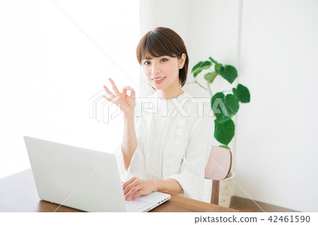 Young lady playing computer Young lady playing computer 42461590