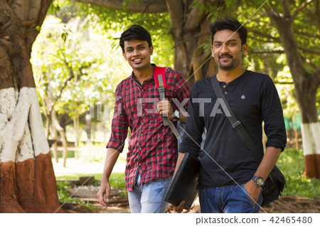 Two young students going to college Two young students going to college 42465480