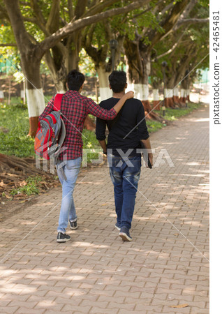 Two young students going to college backpose Two young students going to college backpose 42465481