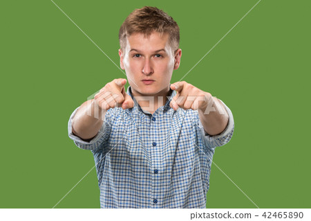 The overbearing businessman point you and want you, half length closeup portrait on green background 42465890