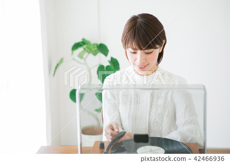 A woman wearing a record A woman wearing a record 42466936