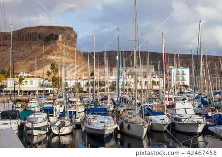 Sailboats and yachts in harbor on sunset Sailboats and yachts in harbor on sunset 42467458