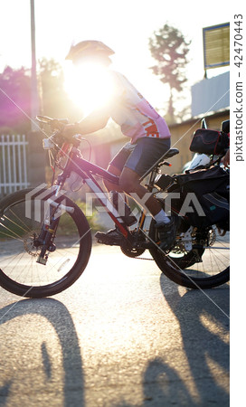 biking abstract in the morning sun with no face 42470443