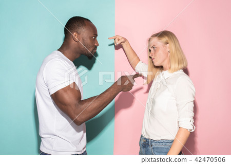 Man and woman posing at studio during quarrel 42470506