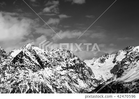 Snowy rocks  at sunny day 42470596