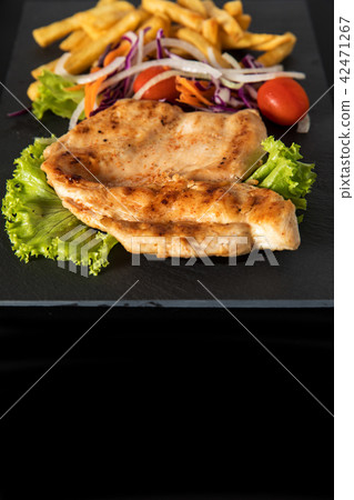 Juicy grilled chicken breast steak with fresh 42471267
