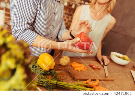Close up of male hand that holding pepper Close up of male hand that holding pepper 42471963