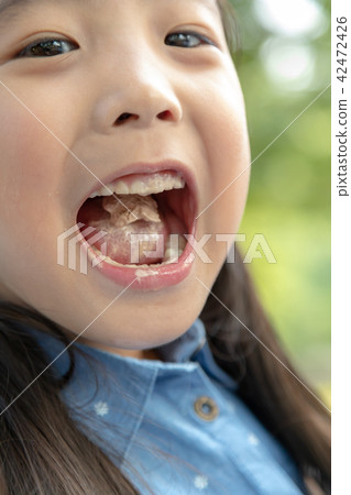 Naughty kids have ice cream in your mouth 42472426