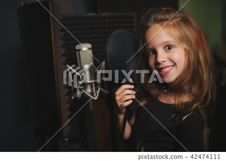 little girl singing in recording studio little girl singing in recording studio 42474111