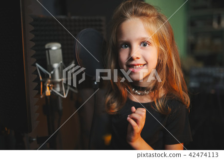 little girl singing in recording studio little girl singing in recording studio 42474113
